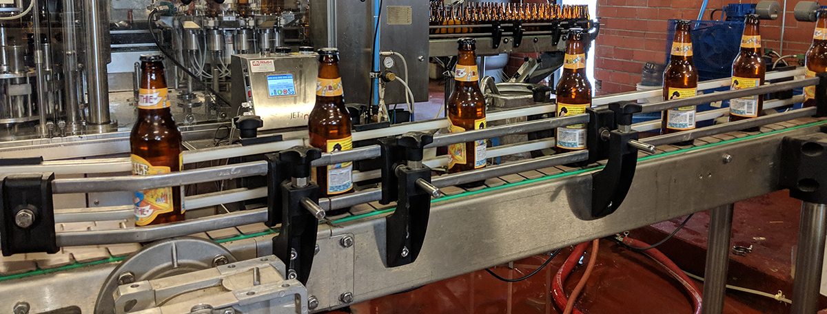 Brewery assembly line of beer bottles