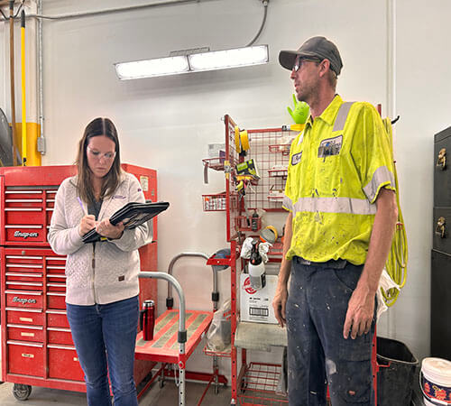 Jen Wittenburg conducting a site visit at an Iowa small businesss